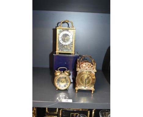 A Smiths brass 8 day lantern clock, having domed bell top, chapter ring and Roman numerals, h15cm, sold together with an alar