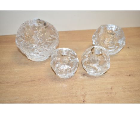 A Kosta Boda 'snowball' candleholder, h9.5cm, sold together with three others, (4)