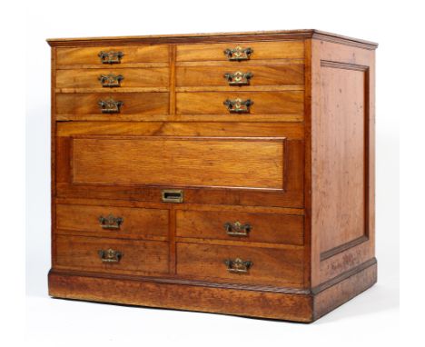 A Victorian mahogany plan chest, with two six short drawers above a recessed flap revealing three long drawers above for shor