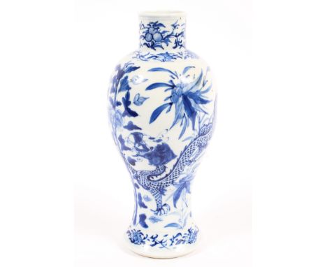 A Chinese porcelain blue and white baluster vase, 19th century, with four character mark, painted with a scrolling scale patt