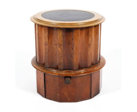 A 19th century walnut cylindrical commode cabinet, the hinged upholstered top above faceted column-shaped mid section with lo