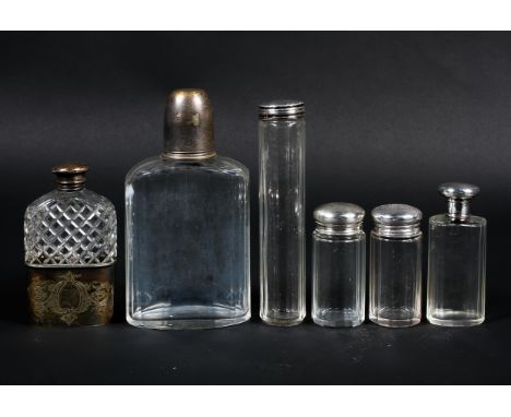 A collection of hallmarked sterling silver topped glass dressing table items together with a silver plated and cut glass hip 