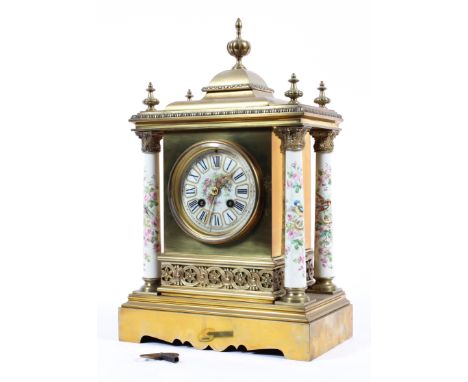 A French porcelain and enamel mounted gilt brass mantle clock, with AD Mougin Deux Medailles, the movement striking on a coil