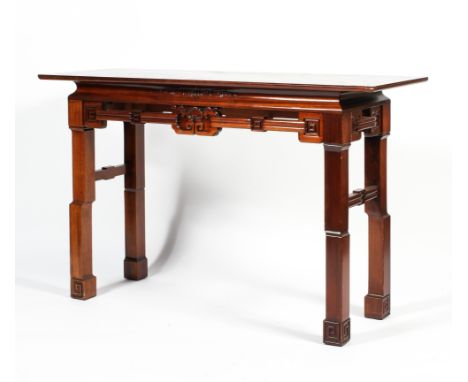 A contemporary Chinese carved hardwood altar table, the rectangular top above a carved apron with strapwork key pattern and f