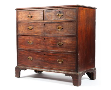 A Georgian mahogany chest of drawers, with two short drawers above three long graduated cockbeaded drawers, on ogee bracket f