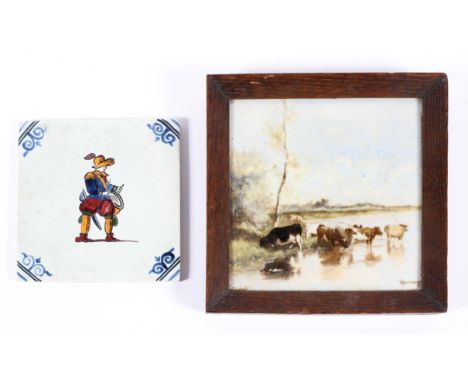 A 19th century Delft tile and another later, the first painted with cattle before a lake, signed Rozenbourg, framed, 18 cm sq