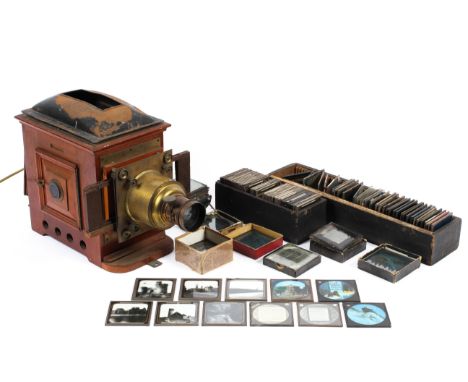 A magic lantern projector with a large collection of glass slides, with images of London, the Isle of man and others, 46cm