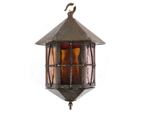 An Arts and Crafts copperised  ceiling lantern, with planished decoration with six glass panels, 31cm(h)