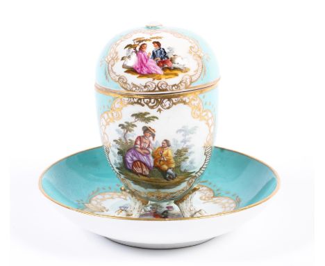 A Dresden turquoise ground cup, cover and a Meissen (outside decorated) saucer, late 19th century, cancelled blue crossed swo