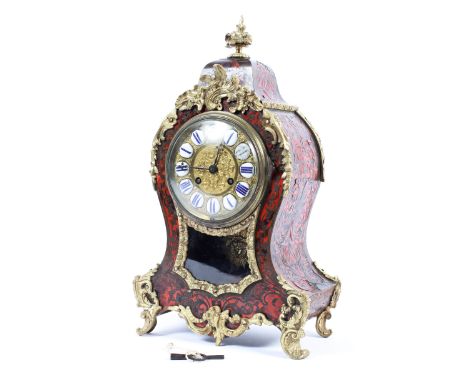 A French Boulle work gilt-metal mounted striking mantle clock, late 19th century, of scroll outline, with white enamel Roman 