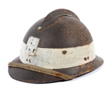 A WWII French Adrian Defence Passive DP - Civil Defence army helmet, with chin strap and later paint