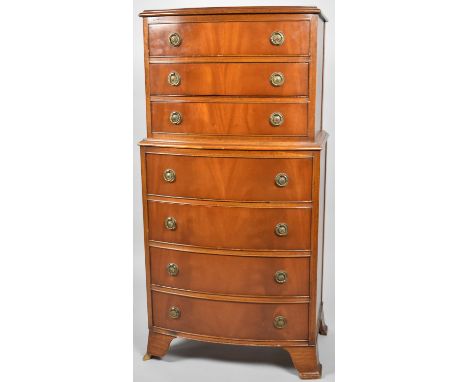 A Mid 20th Century Bow Fronted Chest on Chest, the Base Section with Four Drawers and Bracket Feet, Top Section with Three Dr