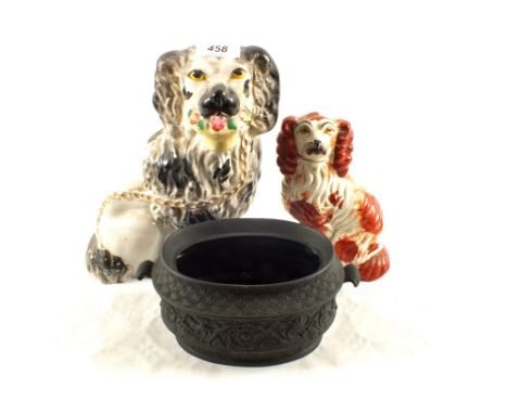 A Victorian Staffordshire dog with flower basket, Russet dog and a Basalt sucrier (some damage)