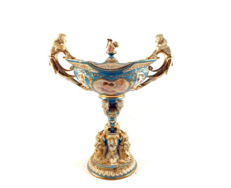 A 19th Century Serves lidded pedestal urn with cherub finial and caryatid handles with cherub and floral painting and gilding