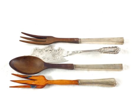 A white metal cake slice, a white metal handled wooden salad fork plus a pair of Silver handled wooden salad servers