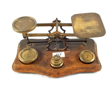 A set of Brass postal scales and weights