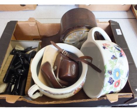 An Oak striking mantel clock, Voigtlander camera, Ebony dressing table wares plus two floral chamber pots