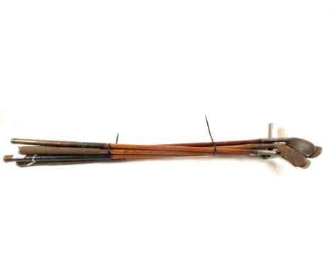 Seven various vintage wooden shaft golf clubs