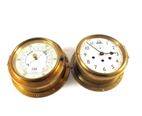 A Brass ships barometer by Cooke, Hull and a circular Brass ships clock