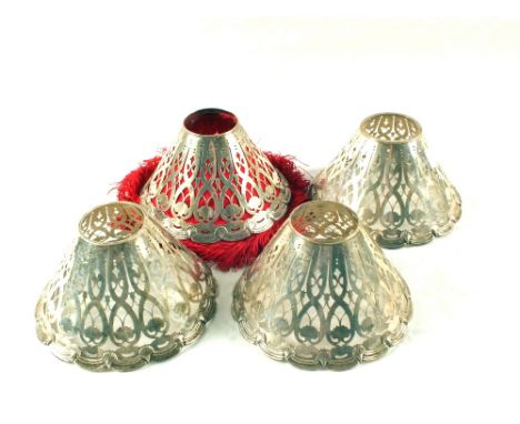A set of four Tiffany Silver pierced lamp shades, No.17579