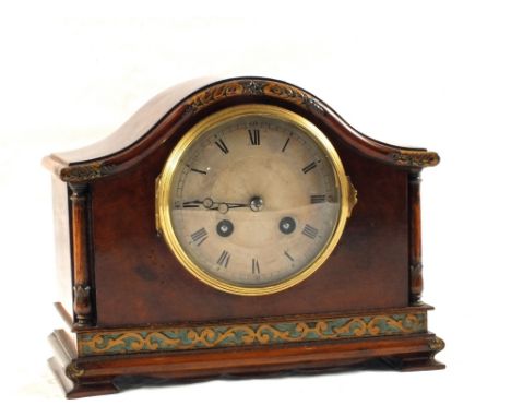 An Edwardian Walnut striking mantel clock