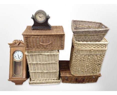 Six various wicker baskets, wall clock and a mantel clock 