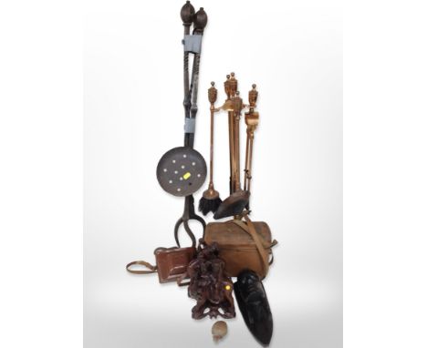 A group of oriental and African hardwood carvings, a copper-plated companion set on stand, other metal wares, vintage cameras