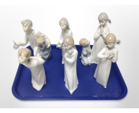 Six Lladró/Nao figures of children in night dress.