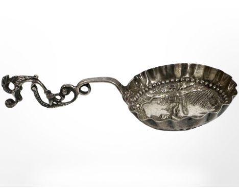 An ornate Dutch silver caddy spoon, length 12.5cm CONDITION REPORT: 25.9g