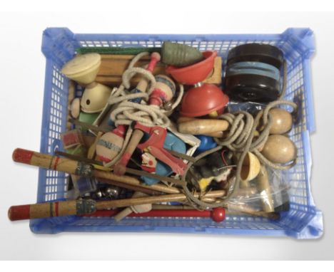 A group of vintage toys including skipping ropes, spinning tops, together with a recorder and rattle, whistle, etc.