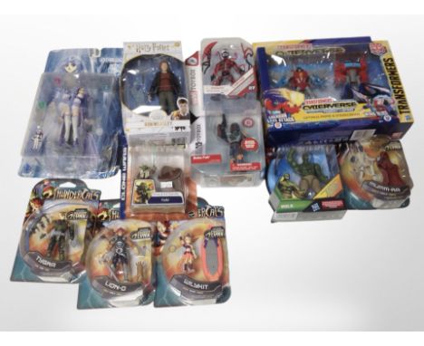 A group of Mattel and other figures including Transformers, Harry Potter, Thundercats, etc., all boxed.