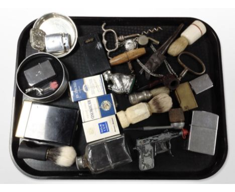 A group of items relating to smoking including lighters, pipes, etc., together with a group of vintage corkscrews, vintage Sp