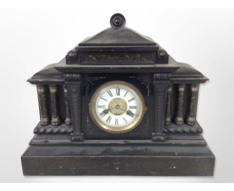 A Victorian ebonised wooden mantel clock with enamelled dial, width 47cm.