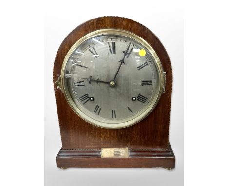 An early 20th-century inlaid mahogany eight-day mantel clock, height 30cm.