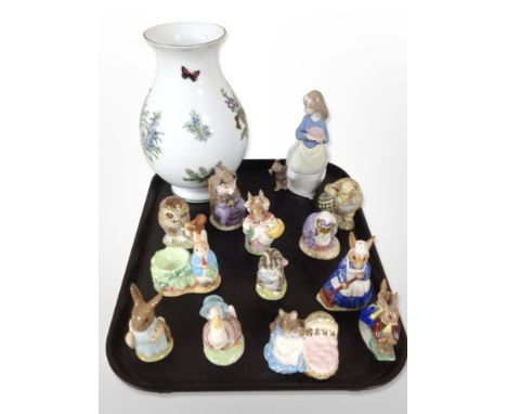 A Royal Worcester porcelain vase, Nao figure of a girl and a dog and twelve Royal Doulton Beatrix Potter figurines.