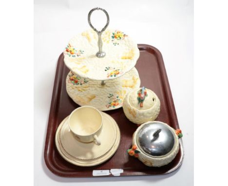 Clarice Cliff  'Celtic Harvest' two-tier cake stand; and a matching preserve jar and sugar bowl; together with a Clarice Clif