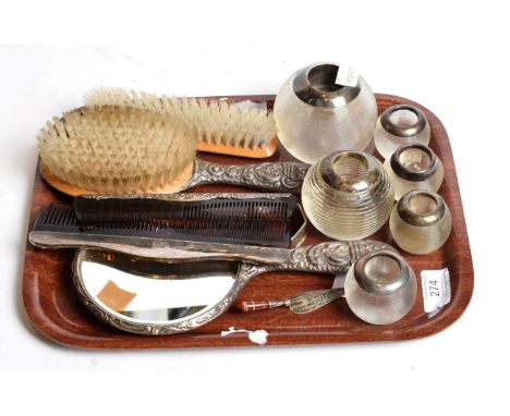 Six various silver mounted match strikers, a three piece silver backed dressing table set, two silver mounted cones, a silver