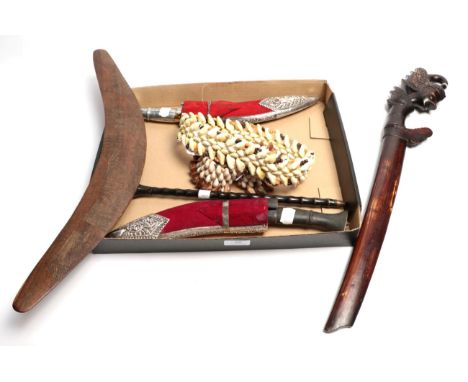 Two modern presentation / ornamental kukris, with white metal-ornamented, red velvet-covered scabbards; an Indonesian parang,