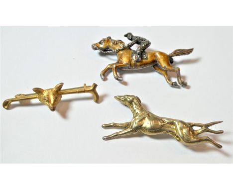 An enamel and marcasite horse and jockey brooch, stamped 'SILVER', length 5.2cm; a hound brooch, stamped 'SILVER', length 5.4