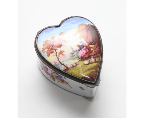 19th Century enamel heart shaped patch box with hinged lid and white metal mounts. The lid is decorated with landscape & past