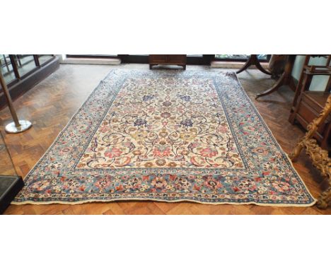 Thick wool pile blue & cream patterned Persian designed carpet. Measuring approximately 12' by 8' 6"