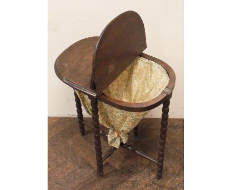 Oak lift top work basket on bobbin turned legs