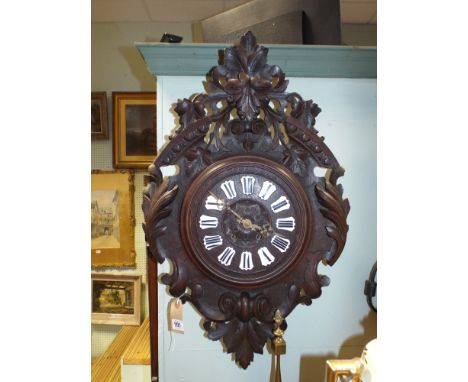 French carved oak framed wall clock with Roman enamel numerals and striking movement 28" high 