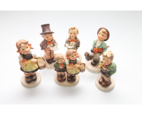 Group of 6 Hummel Goebel porcelain figures to include street singer, soloist and trumpet boy