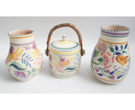 Three pieces of early traditional Poole Pottery floral decorated ware to include 2 vases and a biscuit barrel 
