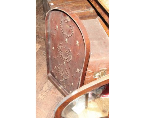 Bagatelle board and an oval wall mirror