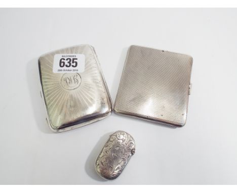 2 hallmarked silver cigarette cases with engine turned detail and a hallmarked engraved oval match case.  Gross weight 5.7oz 