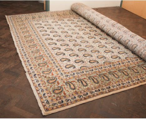 Cream & patterned wool pile Persian design carpet. Measuring approximately 12' 6" by 9' 6"