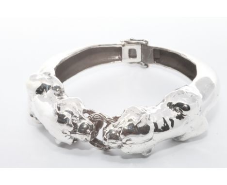 Silver hinged ladies bangle with panther and ring central panel. 76.5 grams