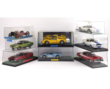 Eight 1:18 scale Ford die-cast cars comprising ; AUTOart Mustang Fastback Mach 1, Universal Hobbies Ford GT 40, AUTOart Ford 